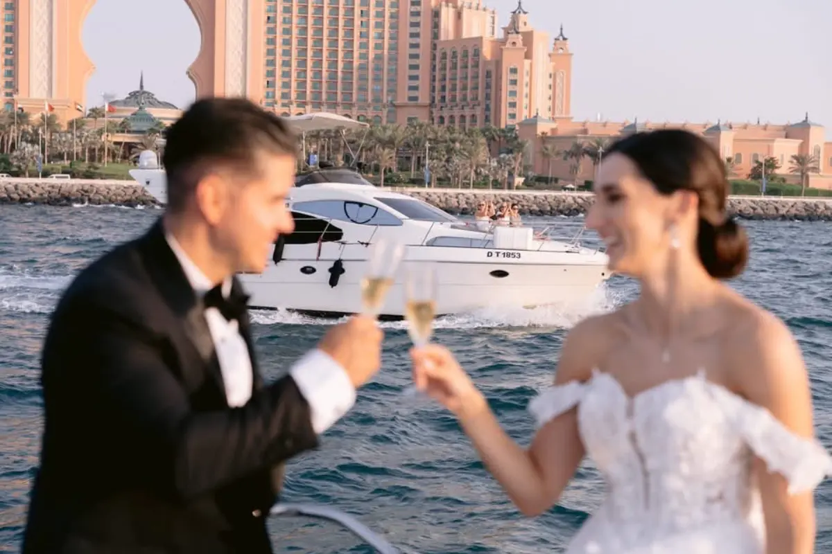 couple enjoying drink after yacht proposal event